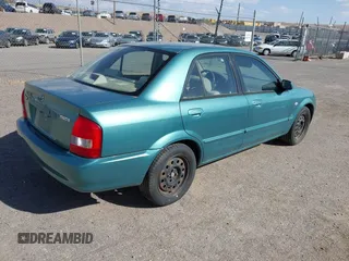 2002 Mazda Protege DX z VIN JM1BJ225021606891, wystawiony jako IAAI lot #42011997 z przebiegiem 134 758 mil mil oraz . Historia ofert i sprzedaży dostępna na DreamBid. Obrazek 4.