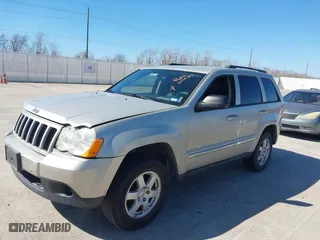 2010 Jeep Grand Cherokee Laredo with VIN 1J4PS4GK1AC111965, listed as a IAAI auction lot 41776362 with 209,042 mi miles. Bid and sale history available at carsss.com. Image 2.