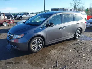 2014 Honda Odyssey Touring with VIN 5FNRL5H94EB081267, listed as a IAAI auction lot 41199509 with 146,827 mi miles and . Bid and sale history available at DreamBid. Image 17.