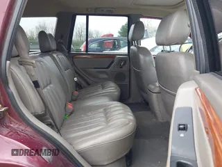 1999 Jeep Grand Cherokee Limited with VIN 1J4GW68N5XC642670, listed as a IAAI auction lot 41990199 with 154,492 mi miles. Bid and sale history available at carsss.com. Image 8.