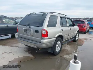 2004 Isuzu Rodeo S with VIN 4S2CK58W344311048, listed as a IAAI auction lot 41472392 with 128,732 mi miles. Bid and sale history available at carsss.com. Image 4.