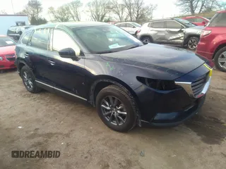 2021 Mazda CX-9 Sport with VIN JM3TCBBY4M0519407, listed as a IAAI auction lot 40883497 with 90,205 mi miles and . Bid and sale history available at carsss.com. Image 1.