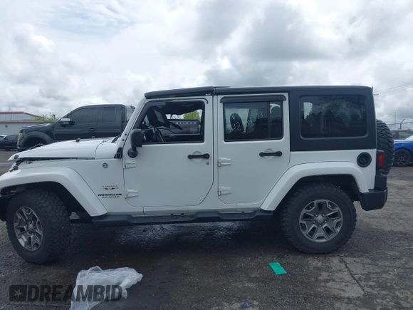 2016 Jeep Wrangler Unlimited Sahara with VIN 1C4BJWEG8GL129577, listed as a IAAI auction lot 42184373 with 185,761 mi miles and . Bid and sale history available at DreamBid. Image 13.