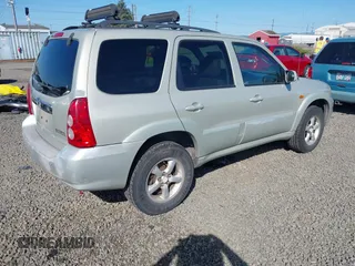 2005 Mazda Tribute S with VIN 4F2CZ96105KM04032, listed as a IAAI auction lot 42157429 with 199,704 mi miles and . Bid and sale history available at carsss.com. Image 4.