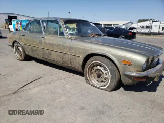 1974 Jaguar XJ with VIN UE2T52398, listed as a Copart auction lot 59589415 with 93,740 mi miles and Clean title. Bid and sale history available at DreamBid. Image 4.