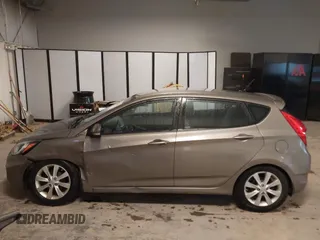 2013 Hyundai Accent SE with VIN KMHCU5AE6DU097353, listed as a IAAI auction lot 41937225 with 173,447 mi miles. Bid and sale history available at carsss.com. Image 14.