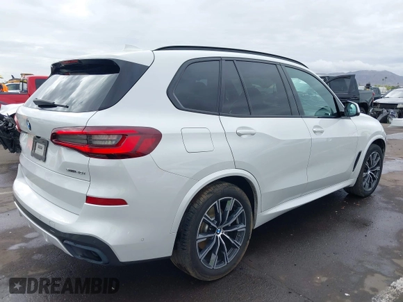 2020 BMW X5 sDrive40i with VIN 5UXCR4C04L9D41635, listed as a IAAI auction lot 42201174 with 64,989 mi miles and . Bid and sale history available at DreamBid. Image 4.