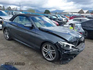 2016 BMW 2 Series 228i xDrive with VIN WBA1L9C5XGV767324, listed as a IAAI auction lot 41795604 with 133,276 mi miles. Bid and sale history available at carsss.com. Image 1.