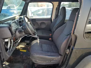 2001 Jeep Wrangler Sport with VIN 1J4FA49SX1P318889, listed as a Copart auction lot 67213064 with 157,444 mi miles and Clean Title. Bid and sale history available at carsss.com. Image 7.