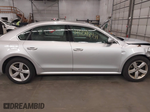 2013 Volkswagen Passat SE with VIN 1VWBH7A39DC145297, listed as a IAAI auction lot 42048991 with 146,897 mi miles and . Bid and sale history available at DreamBid. Image 14.