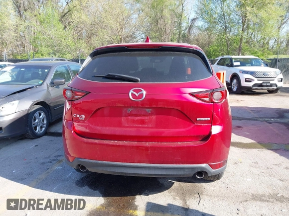 2021 Mazda CX-5 Grand Touring with VIN JM3KFBDM8M1390188, listed as a IAAI auction lot 42000444 with 84,908 mi miles. Bid and sale history available at carsss.com. Image 15.
