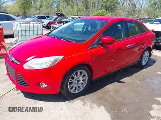 2012 Ford Focus SE z VIN 1FAHP3F23CL333598, wystawiony jako IAAI lot #41970172 z przebiegiem 209 969 mil mil oraz . Historia ofert i sprzedaży dostępna na DreamBid. Obrazek 20.