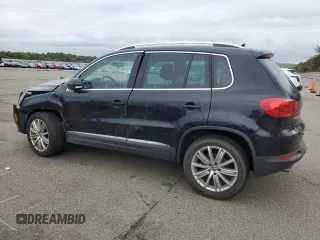 2014 Volkswagen Tiguan S z VIN WVGBV3AX5EW554500, wystawiony jako Copart lot #57016775 z przebiegiem 91 101 mil mil oraz Szkoda całkowita • Salvage title. Historia ofert i sprzedaży dostępna na DreamBid. Obrazek 2.