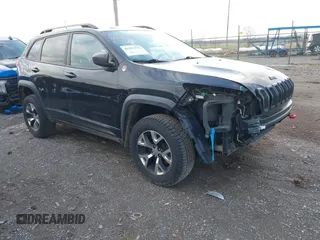 2016 Jeep Cherokee Trailhawk z VIN 1C4PJMBB5GW132003, wystawiony jako IAAI lot #41917571 z przebiegiem 153 847 mil mil oraz . Historia ofert i sprzedaży dostępna na DreamBid. Obrazek 1.
