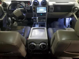 2003 Hummer H2 z VIN 5GRGN23U03H113929, wystawiony jako Copart lot #49540455 z przebiegiem 126 254 mil mil oraz Tytuł czysty. Historia ofert i sprzedaży dostępna na DreamBid. Obrazek 8.