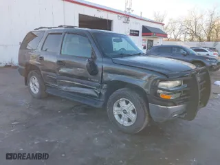 2002 Chevrolet Tahoe LS with VIN 1GNEK13V82J180328, listed as a IAAI auction lot 40810285 with 210,728 mi miles. Bid and sale history available at carsss.com. Image 1.