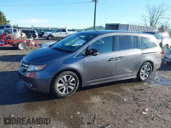 2014 Honda Odyssey Touring with VIN 5FNRL5H94EB081267, listed as a IAAI auction lot 41199509 with 146,827 mi miles and . Bid and sale history available at DreamBid. Image 14.
