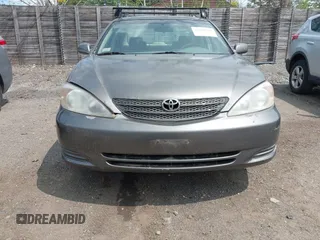 2002 Toyota Camry LE z VIN JTDBE32KX20070778, wystawiony jako IAAI lot #42389584 z przebiegiem 278 070 mil mil oraz . Historia ofert i sprzedaży dostępna na DreamBid. Obrazek 6.