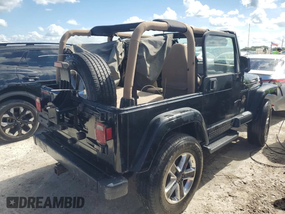 2002 Jeep Wrangler Sahara with VIN 1J4FA59S62P722411, listed as a Copart auction lot 74080364 with 0 mi miles and Non Repairable. Bid and sale history available at carsss.com. Image 3.