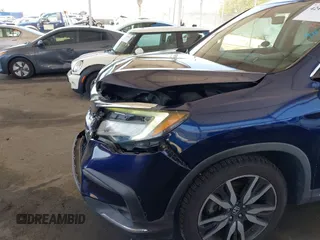 2019 Honda Pilot Touring 8-Passenger z VIN 5FNYF5H97KB013530, wystawiony jako IAAI lot #42403449 z przebiegiem 90 557 mil mil oraz . Historia ofert i sprzedaży dostępna na DreamBid. Obrazek 6.