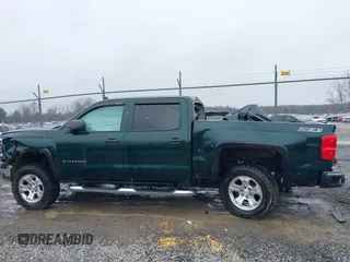 2014 Chevrolet Silverado 1500 LT with VIN 3GCUKREC1EG516826, listed as a IAAI auction lot 41119573 with 164,844 mi miles and . Bid and sale history available at DreamBid. Image 15.