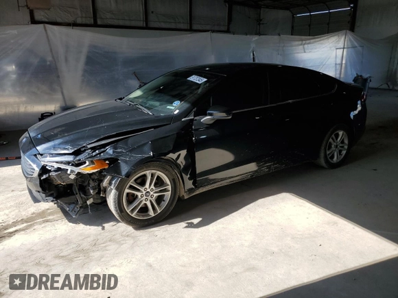 2018 Ford Fusion SE z VIN 3FA6P0HDXJR130677, wystawiony jako Copart lot #51737345 z przebiegiem 129 918 mil mil oraz Szkoda całkowita • Salvage title. Historia ofert i sprzedaży dostępna na DreamBid. Obrazek 1.