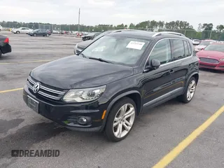 2012 Volkswagen Tiguan S with VIN WVGBV7AX6CW592242, listed as a IAAI auction lot 42215240 with 158,852 mi miles and . Bid and sale history available at DreamBid. Image 2.
