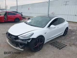 2019 Tesla Model 3 Mid Range with VIN 5YJ3E1EA8KF472540, listed as a IAAI auction lot 41661312 with 75,575 mi miles and . Bid and sale history available at DreamBid. Image 2.