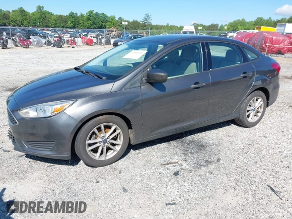 2018 Ford Focus SE z VIN 1FADP3FE1JL238012, wystawiony jako IAAI lot #42185232 z przebiegiem 143 687 mil mil oraz . Historia ofert i sprzedaży dostępna na DreamBid. Obrazek 2.