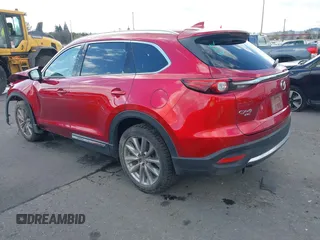 2020 Mazda CX-9 Grand Touring with VIN JM3TCBDY4L0423563, listed as a IAAI auction lot 41829394 with 76,704 mi miles and . Bid and sale history available at DreamBid. Image 3.