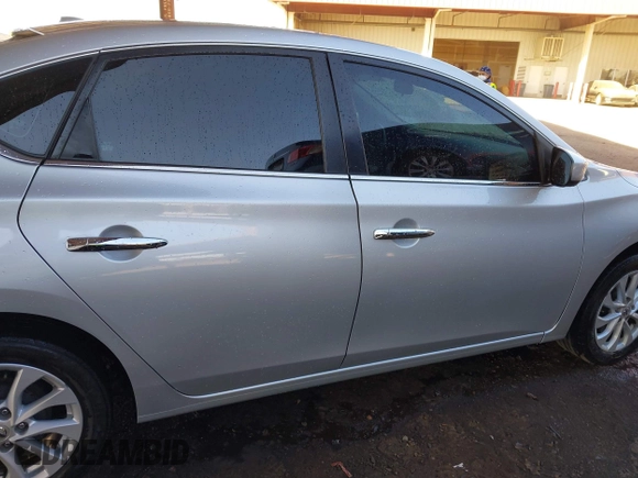 2019 Nissan Sentra S z VIN 3N1AB7AP0KY431212, wystawiony jako IAAI lot #41615063 z przebiegiem 129 322 mil mil oraz . Historia ofert i sprzedaży dostępna na DreamBid. Obrazek 14.