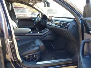 2017 Audi A8 L Sport with VIN WAU43AFDXHN003685, listed as a IAAI auction lot 41264314 with 114,828 mi miles. Bid and sale history available at carsss.com. Image 5.