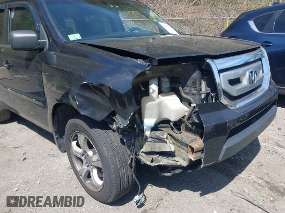 2009 Honda Pilot EX-L with VIN 5FNYF48579B007700, listed as a IAAI auction lot 42084458 with 208,104 mi miles. Bid and sale history available at carsss.com. Image 6.