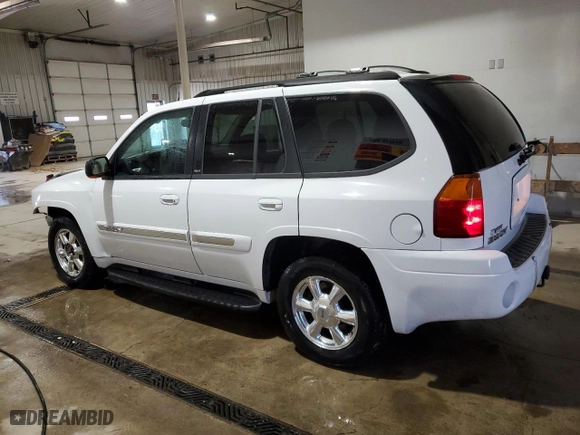 2005 GMC Envoy SLE with VIN 1GKDT13S452315816, listed as a Copart auction lot 52863805 with 128,922 mi miles and Salvage Title. Bid and sale history available at carsss.com. Image 2.