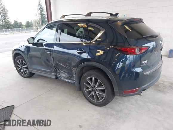 2018 Mazda CX-5 Grand Touring with VIN JM3KFBDM4J0302870, listed as a IAAI auction lot 41934217 with 57,151 mi miles. Bid and sale history available at carsss.com. Image 3.