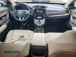 2020 Honda CR-V Touring z VIN 2HKRW2H90LH645727, wystawiony jako Copart lot #62077365 z przebiegiem 58 614 mil mil oraz Szkoda całkowita • Salvage title. Historia ofert i sprzedaży dostępna na DreamBid. Obrazek 8.