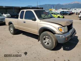 1999 Toyota Tacoma with VIN 4TAWN72N4XZ560411, listed as a Copart auction lot 61499925 with 395,215 mi miles and Salvage title. Bid and sale history available at DreamBid. Image 4.