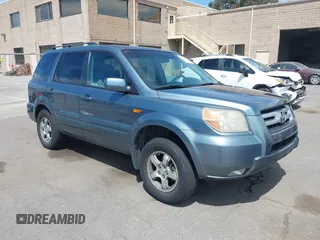 2007 Honda Pilot EX with VIN 2HKYF18447H520522, listed as a IAAI auction lot 42018937 with 128,401 mi miles. Bid and sale history available at carsss.com. Image 1.