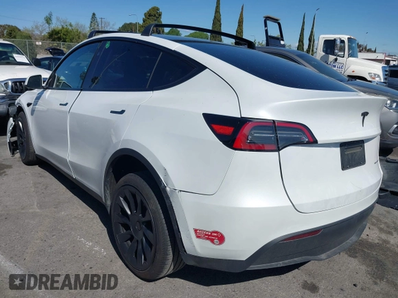 2023 Tesla Model Y Long Range with VIN 7SAYGDEEXPA152986, listed as a IAAI auction lot 41946665 with 13,574 mi miles and . Bid and sale history available at carsss.com. Image 3.