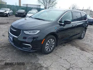 2023 Chrysler Pacifica Hybrid Touring L z VIN 2C4RC1L70PR575342, wystawiony jako IAAI lot #41946079 z przebiegiem 36 304 mil mil oraz . Historia ofert i sprzedaży dostępna na DreamBid. Obrazek 17.