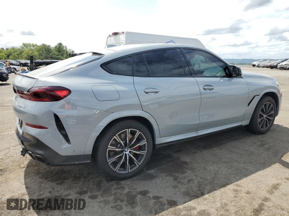 2025 BMW X6 M60i with VIN 5UX43EX06S9W68023, listed as a Copart auction lot 69874764 with 3,789 mi miles and Salvage Title. Bid and sale history available at carsss.com. Image 3.