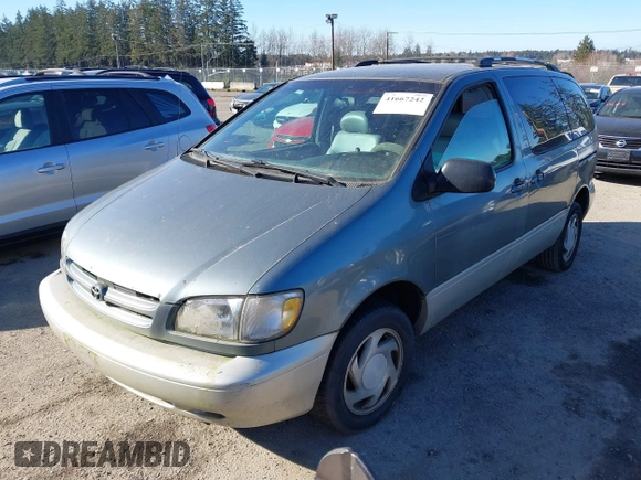 1999 Toyota Sienna LE with VIN 4T3ZF13C3XU103436, listed as a IAAI auction lot 41667242 with 228,318 mi miles. Bid and sale history available at carsss.com. Image 2.