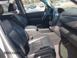 2013 Honda Pilot EX-L with VIN 5FNYF4H71DB041562, listed as a IAAI auction lot 41819184 with 136,014 mi miles and . Bid and sale history available at DreamBid. Image 5.