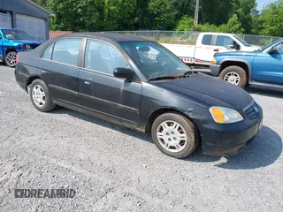 2001 Honda Civic LX z VIN 2HGES16521H558942, wystawiony jako IAAI lot #42409480 z przebiegiem 230 909 mil mil oraz . Historia ofert i sprzedaży dostępna na DreamBid. Obrazek 1.