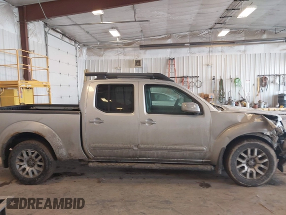 2010 Nissan Frontier SE with VIN 1N6AD0FV5AC439977, listed as a IAAI auction lot 41666404 with 152,004 mi miles and . Bid and sale history available at DreamBid. Image 13.
