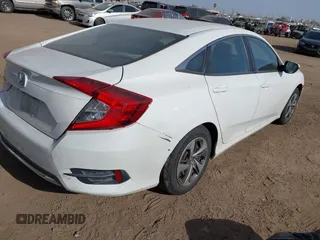 2019 Honda Civic Sedan LX with VIN 2HGFC2F62KH573149, listed as a IAAI auction lot 41575660 with 104,139 mi miles. Bid and sale history available at carsss.com. Image 4.