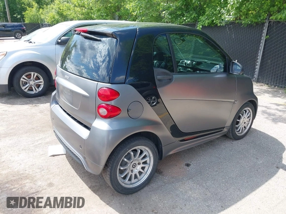 2013 Smart fortwo Pure with VIN WMEEJ3BA9DK585327, listed as a IAAI auction lot 42343616 with 101,194 mi miles and . Bid and sale history available at DreamBid. Image 4.