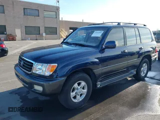 2000 Toyota Land Cruiser with VIN JT3HT05J3Y0098534, listed as a IAAI auction lot 41054858 with 336,520 mi miles. Bid and sale history available at carsss.com. Image 6.