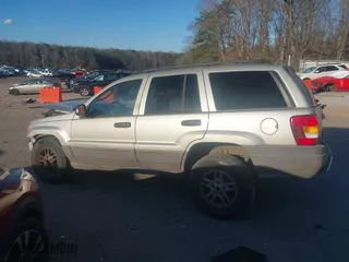 2004 Jeep Grand Cherokee Laredo with VIN 1J4GX48S44C284478, listed as a IAAI auction lot 41253167 with 1 mi miles. Bid and sale history available at carsss.com. Image 14.