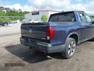 2019 Honda Ridgeline RTL-E with VIN 5FPYK3F76KB010613, listed as a IAAI auction lot 42079810 with 90,492 mi miles and . Bid and sale history available at DreamBid. Image 4.